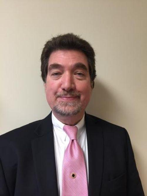 Dr. Charles Meusburger