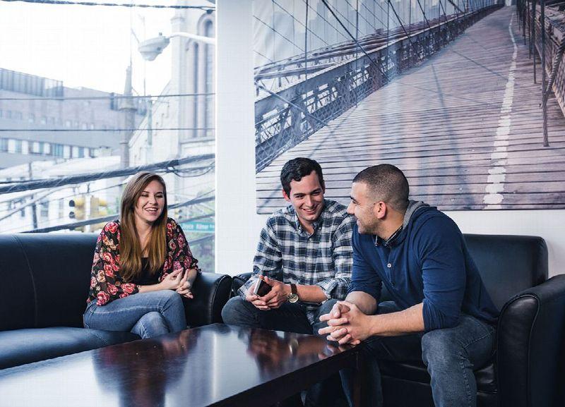 Outpatient rehab patients chatting on a couch